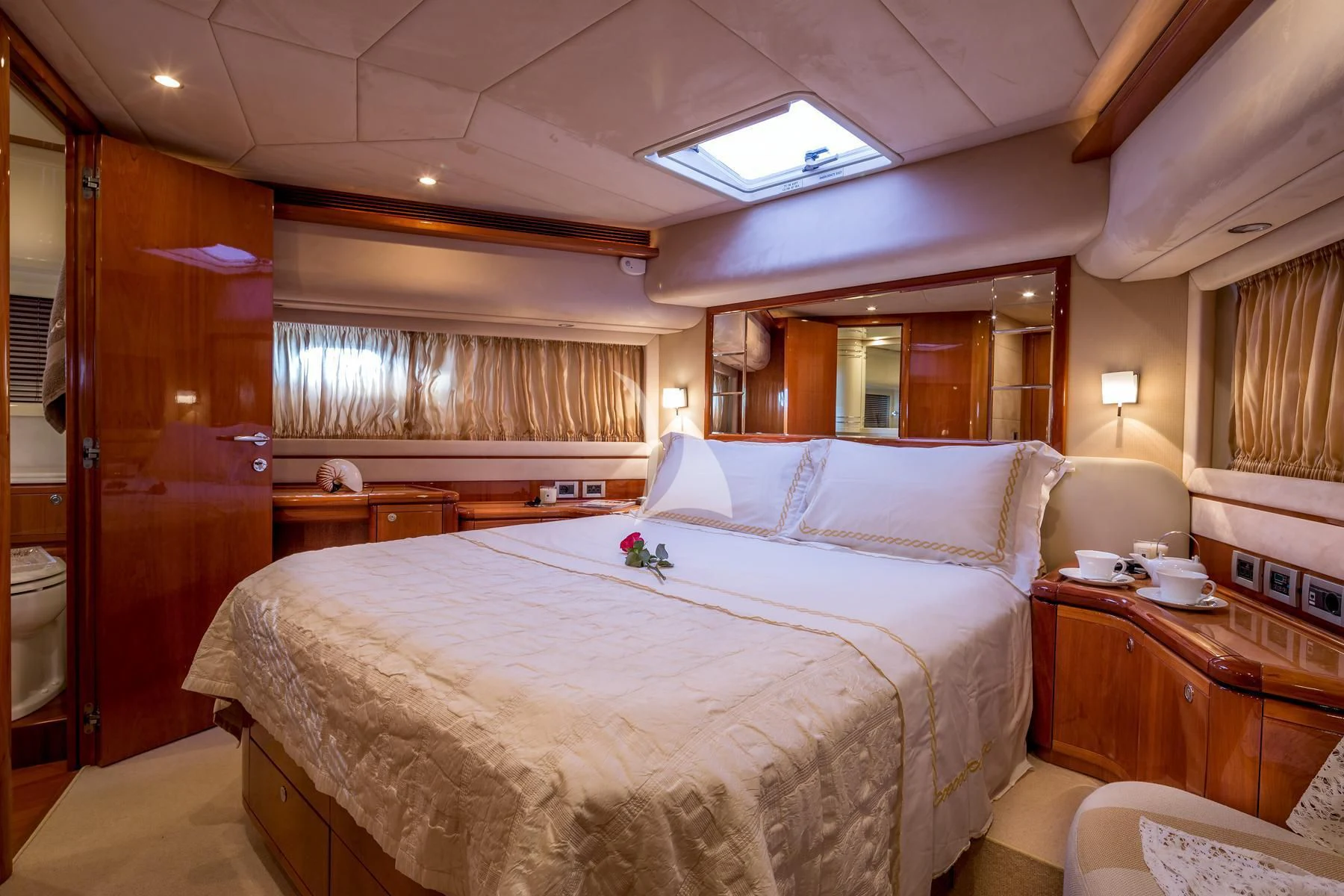 a room with a bed and a desk aboard PIOLA Yacht for Sale