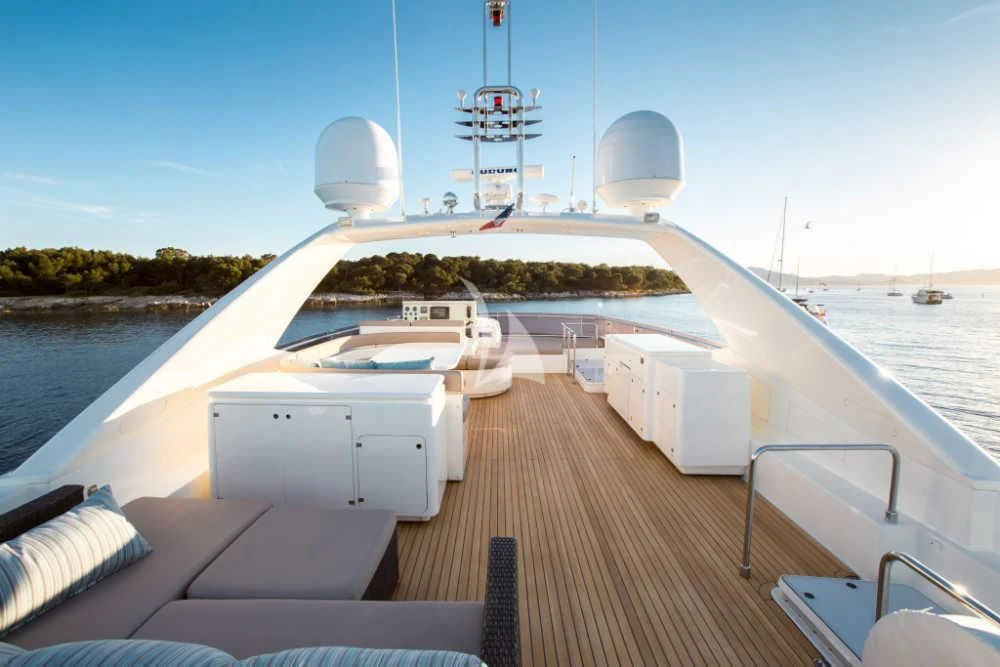 a deck with a deck and a view of the ocean and a large ship aboard PIOLA Yacht for Sale