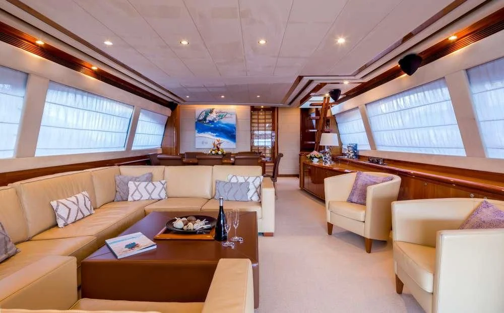 a living room with a large window aboard PIOLA Yacht for Sale