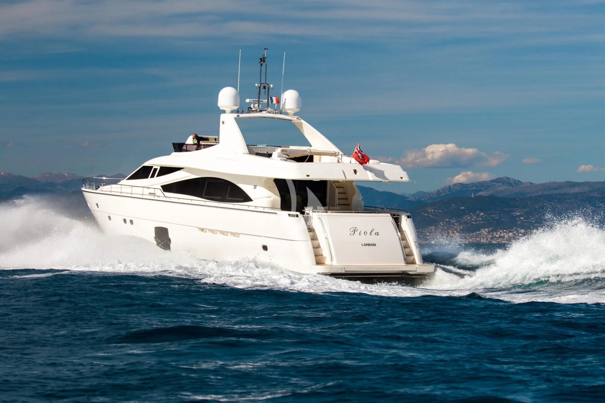 a white boat on water aboard PIOLA Yacht for Sale
