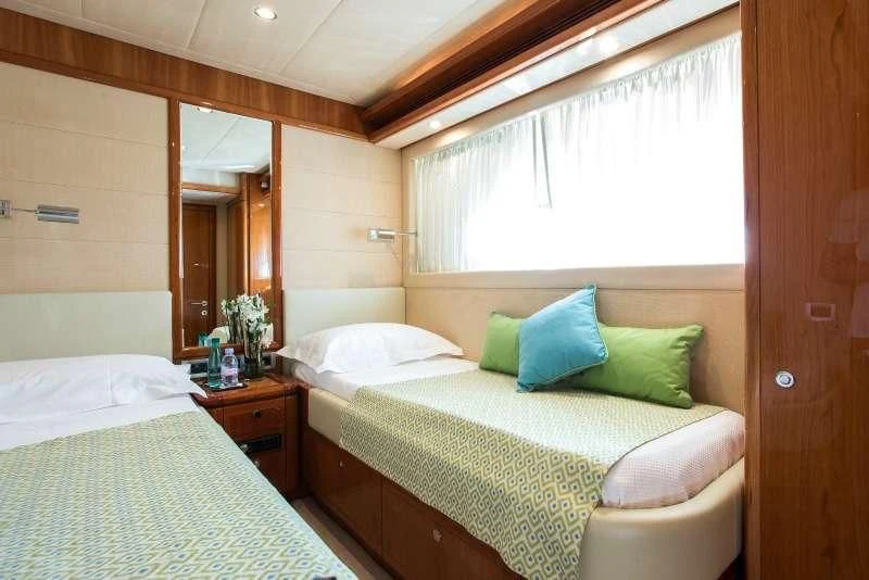 a couple of beds in a room aboard PIOLA Yacht for Sale