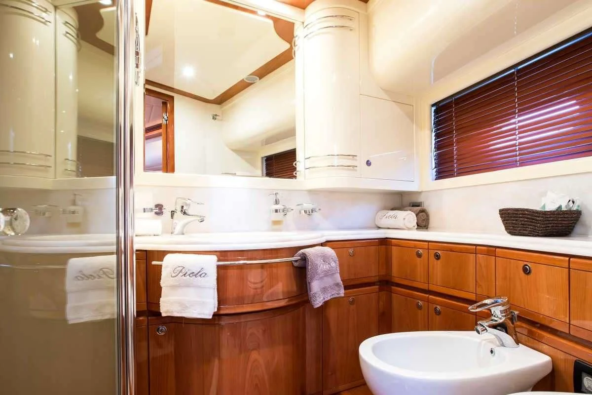 a bathroom with a sink and cabinets aboard PIOLA Yacht for Sale