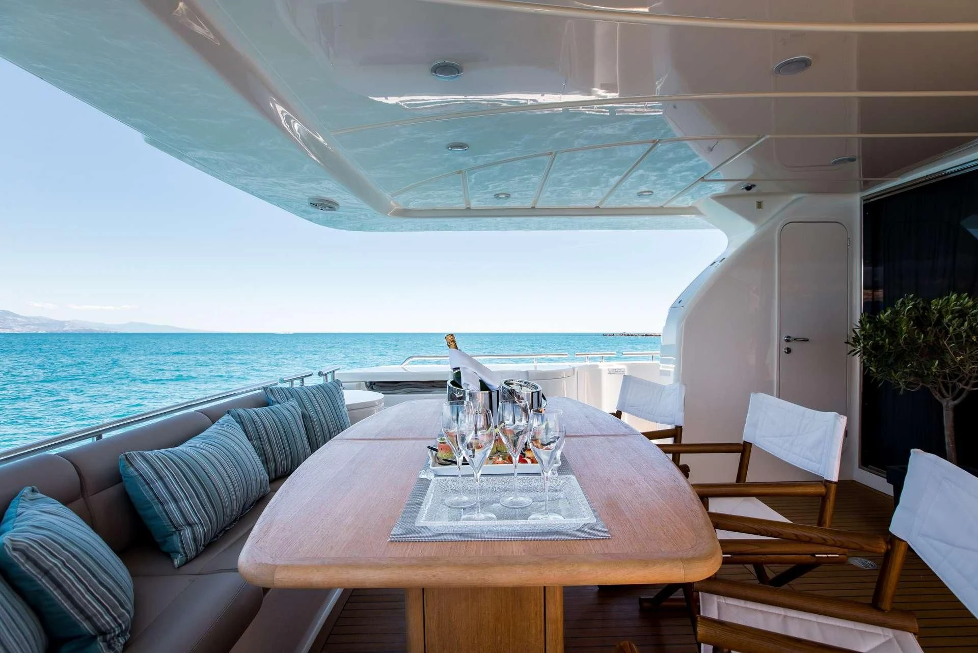 a table with a candle on it aboard PIOLA Yacht for Sale