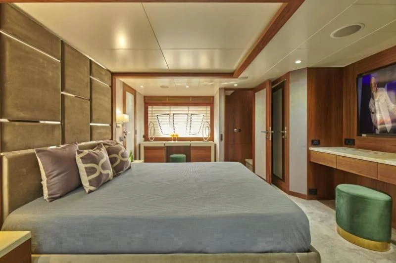 a bed in a room aboard LA FENICE Yacht for Charter