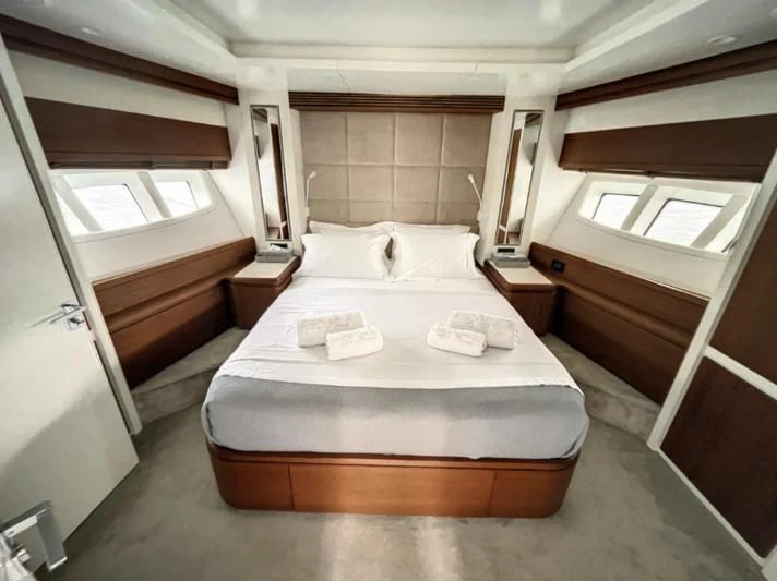 a room with a bed and a window aboard LA FENICE Yacht for Charter