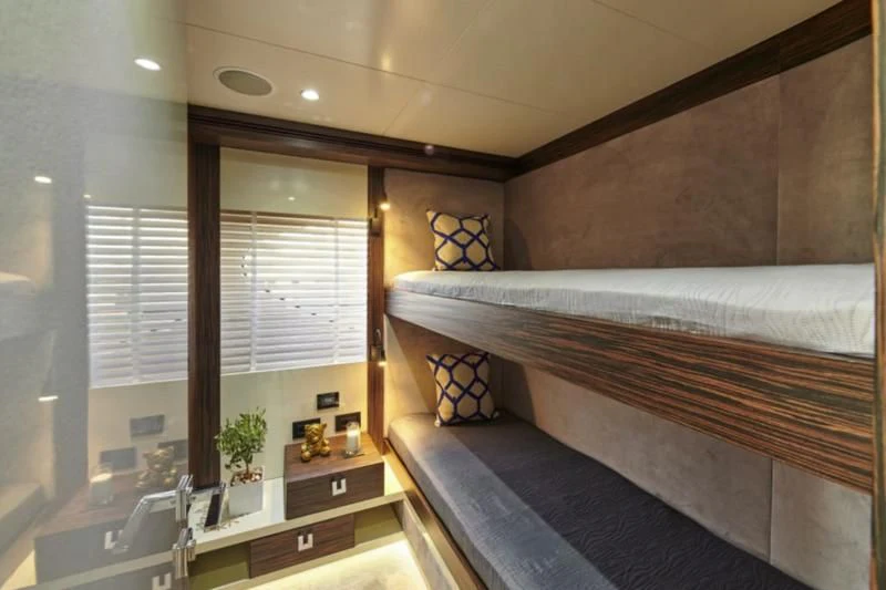 a bedroom with a bed and a window aboard LA FENICE Yacht for Charter