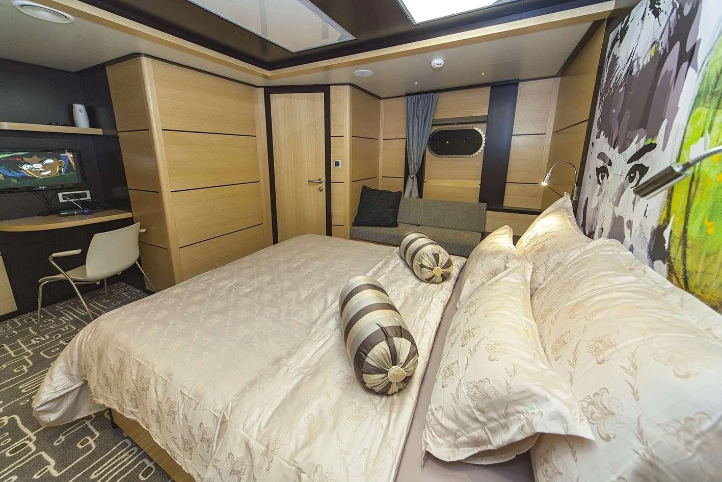 a bed with white sheets aboard NAVILUX Yacht for Sale