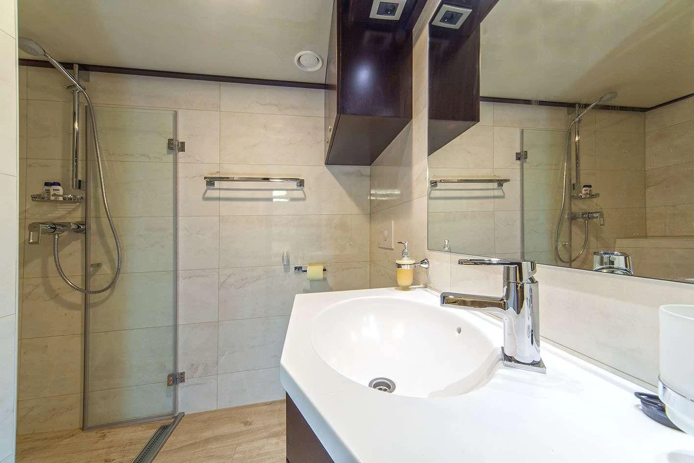 a bathroom with a sink and a shower aboard NAVILUX Yacht for Sale