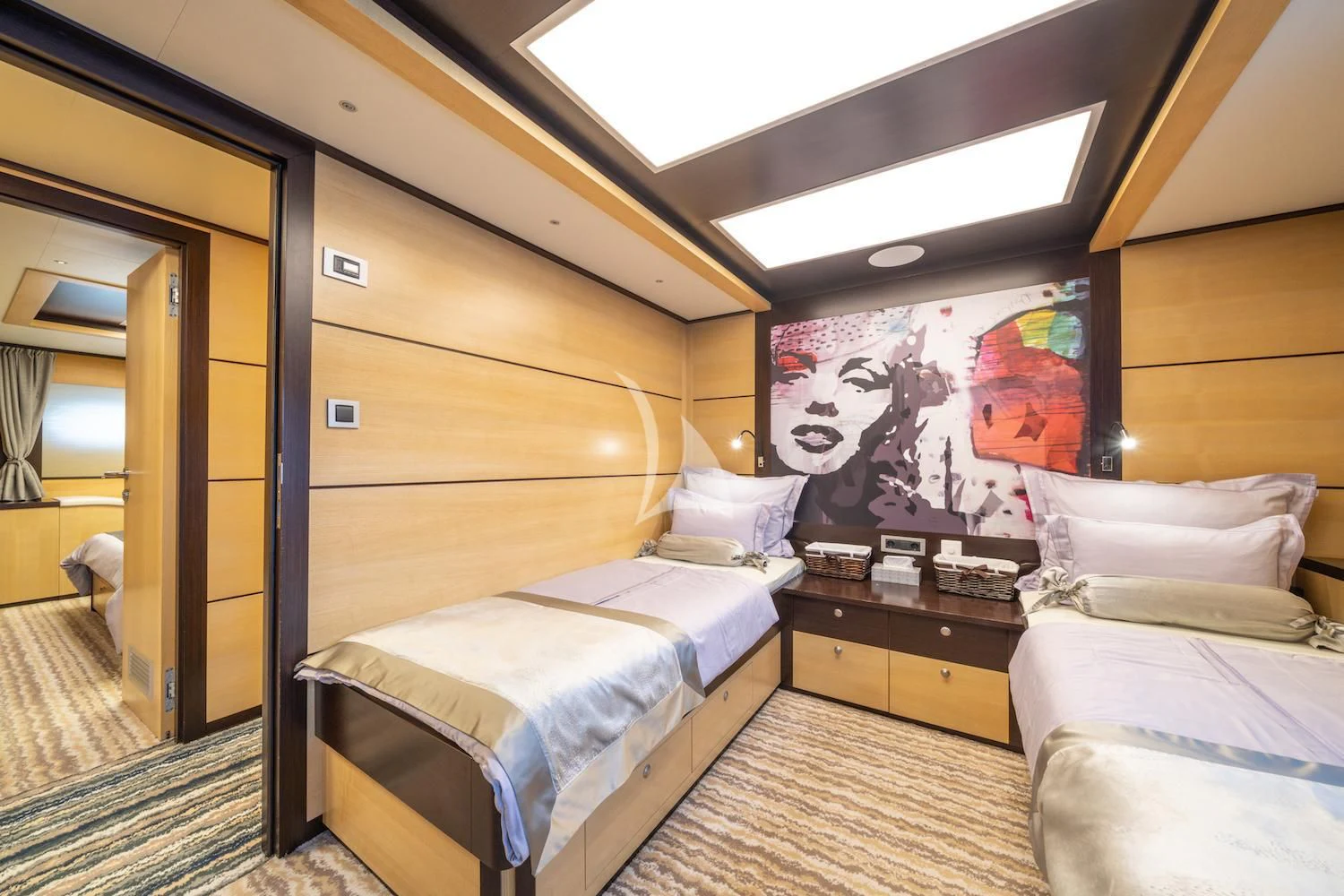 a room with two beds aboard NAVILUX Yacht for Sale
