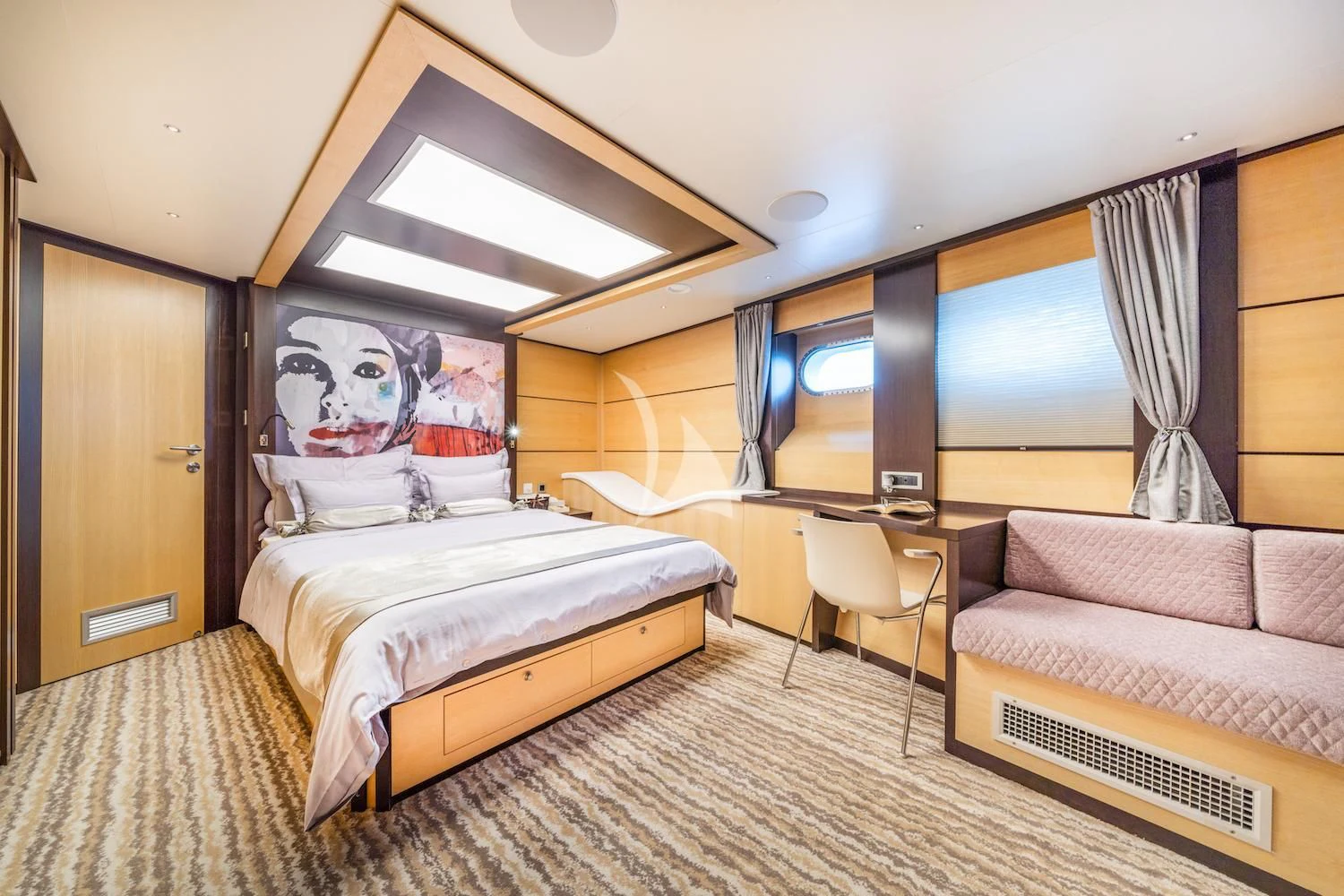 a room with a bed and a desk aboard NAVILUX Yacht for Sale