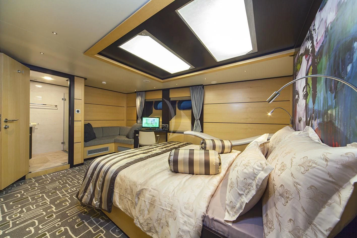 a room with a bed and a tv aboard NAVILUX Yacht for Sale