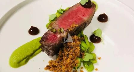 a plate of food aboard NAVILUX Yacht for Sale