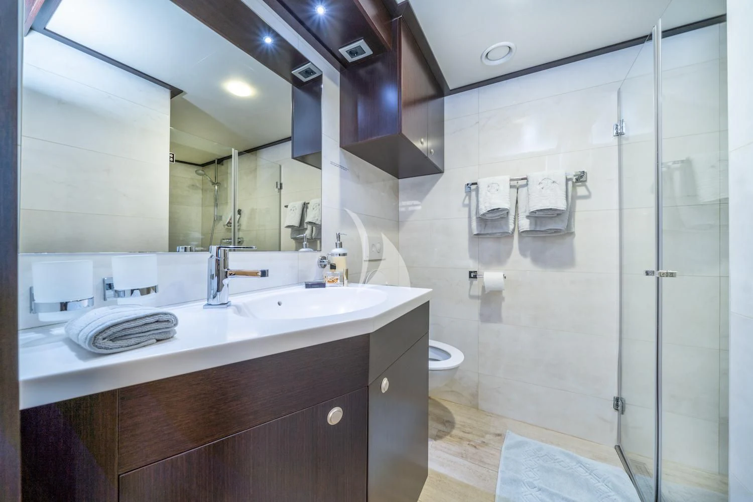 a bathroom with a shower and sink aboard NAVILUX Yacht for Sale