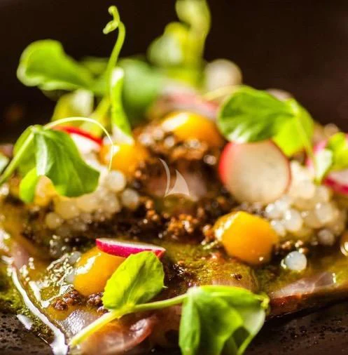 a plate of food aboard NAVILUX Yacht for Sale