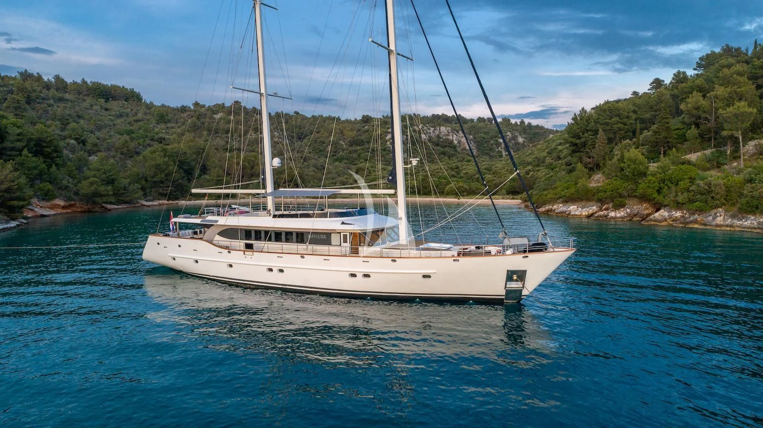 a white boat in the water aboard NAVILUX Yacht for Sale