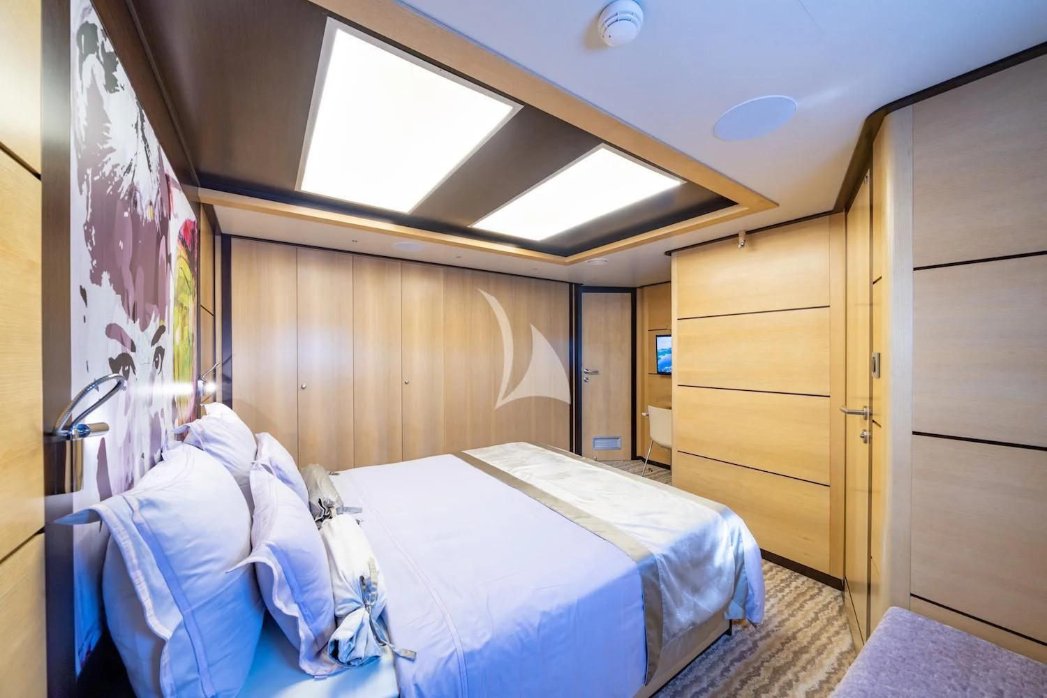 a room with a bed and a closet aboard NAVILUX Yacht for Sale