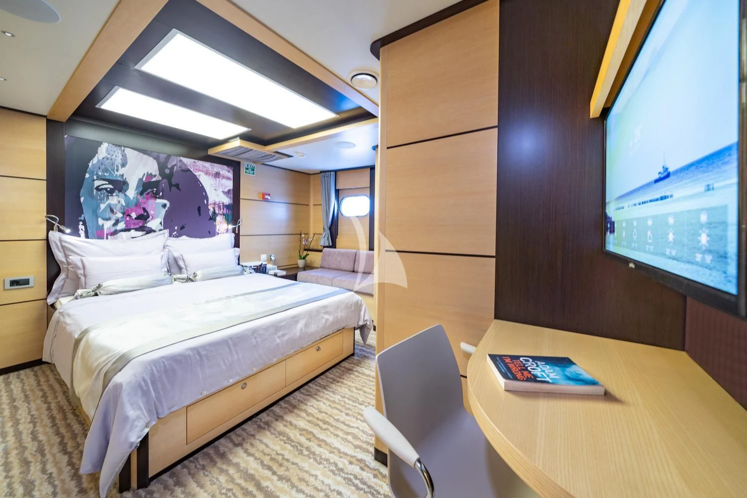 a room with a bed and a desk aboard NAVILUX Yacht for Sale