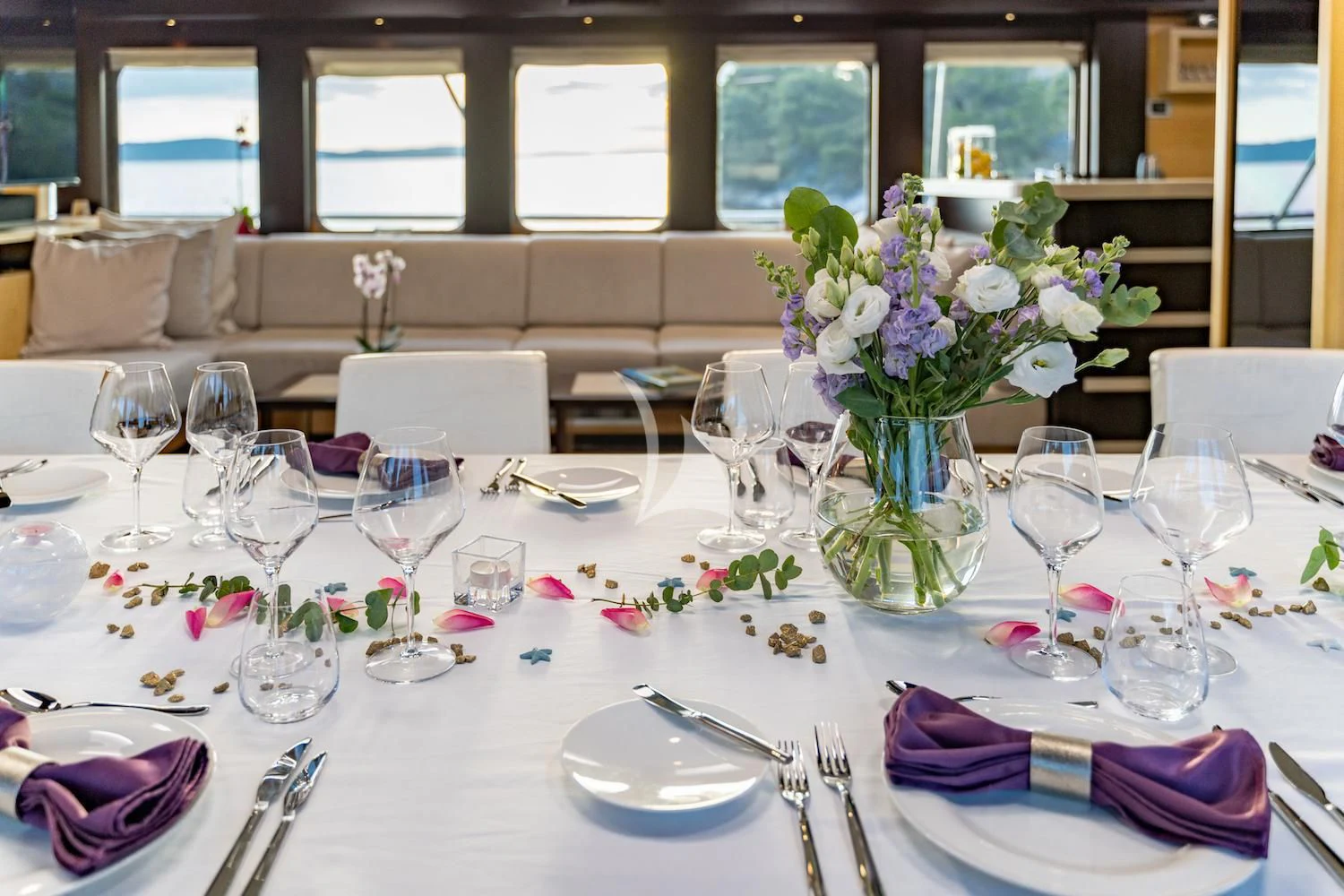 a table set with place settings aboard NAVILUX Yacht for Sale