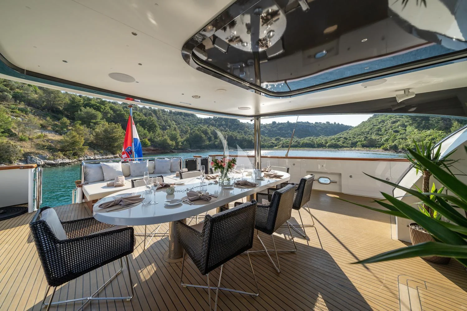 a large table with chairs around it aboard NAVILUX Yacht for Sale