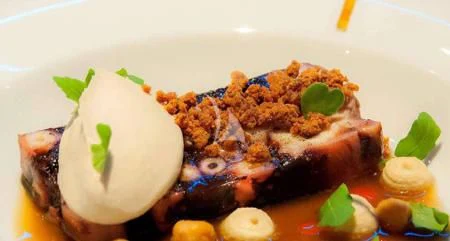 a plate of food aboard NAVILUX Yacht for Sale