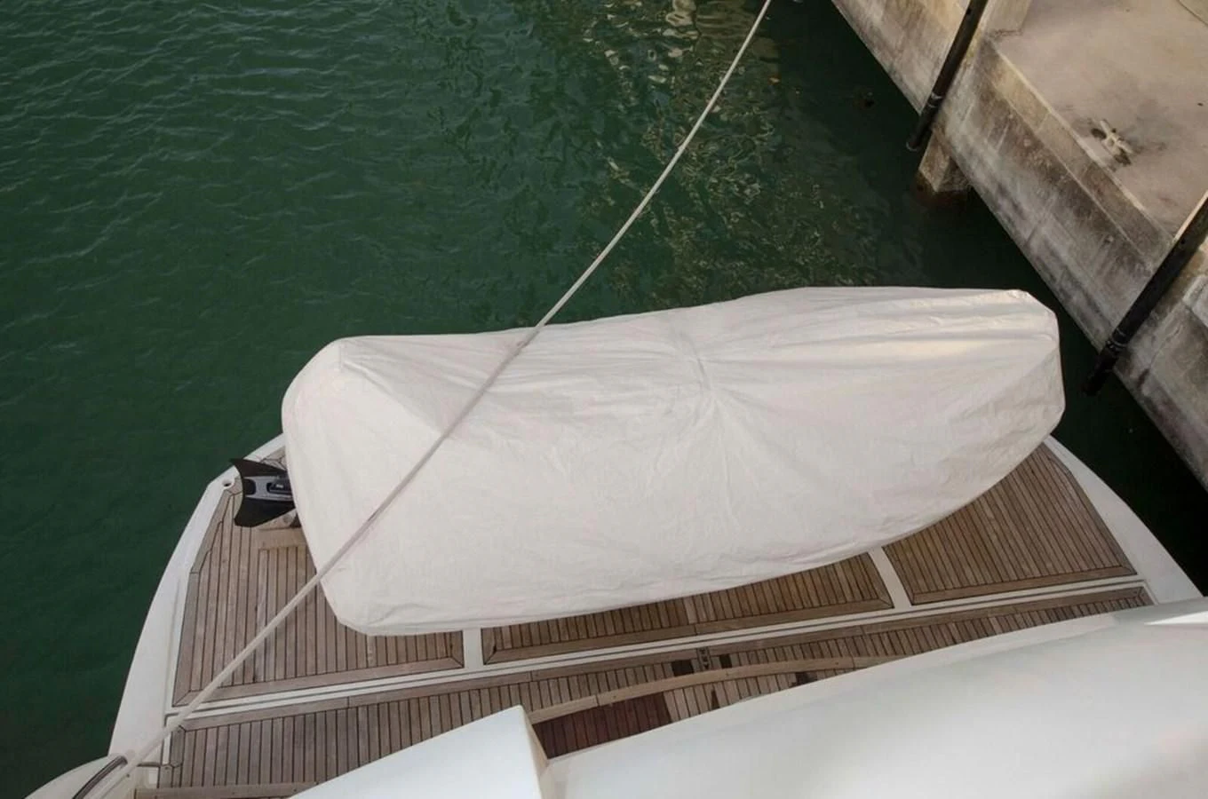 a white boat on a deck aboard SAMARA Yacht for Sale