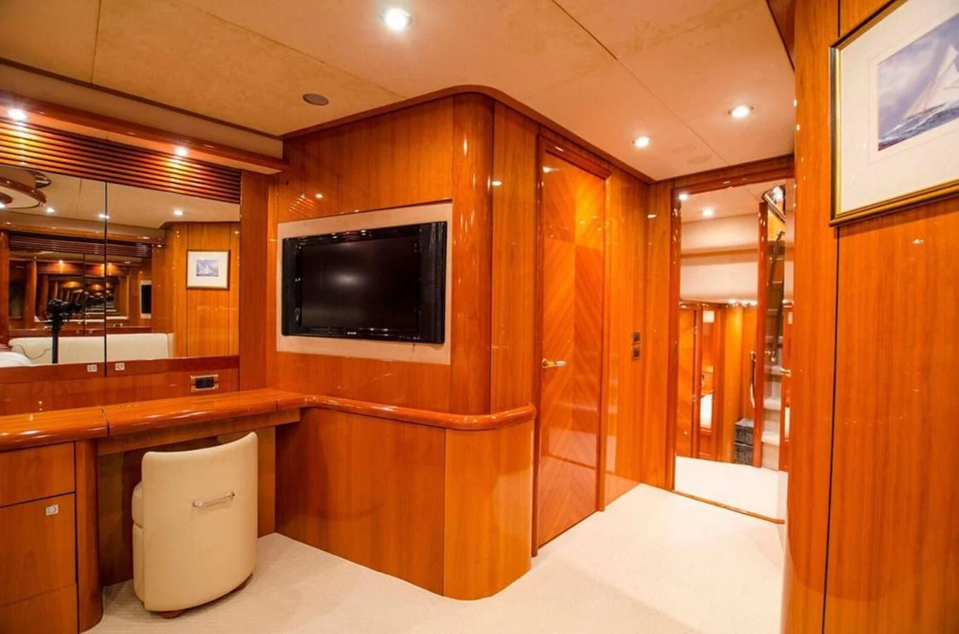 a bathroom with a wood cabinet and a television aboard SAMARA Yacht for Sale
