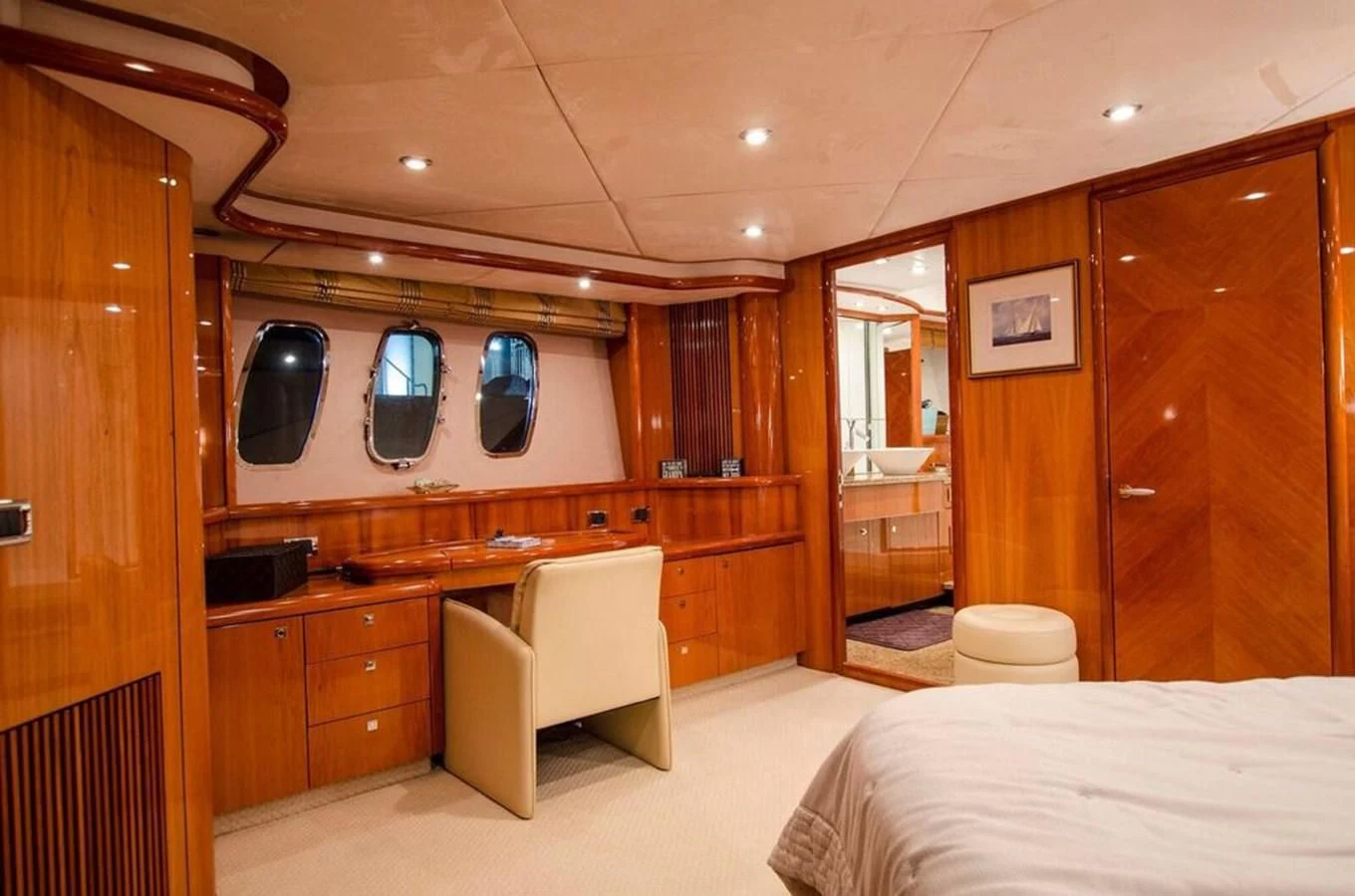 a bedroom with a bed and a desk aboard SAMARA Yacht for Sale