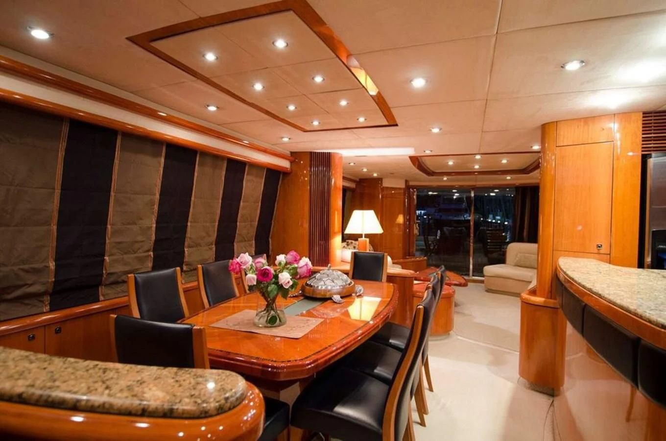 a room with a table chairs and a couch aboard SAMARA Yacht for Sale