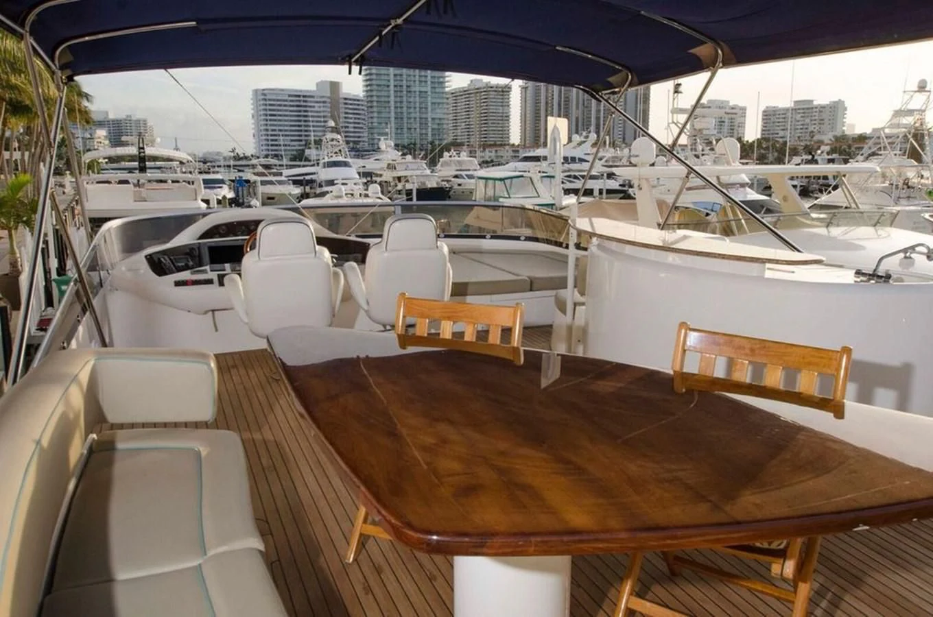a deck with a table and chairs on it aboard SAMARA Yacht for Sale
