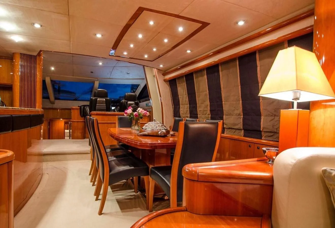 a room with a table and chairs aboard SAMARA Yacht for Sale