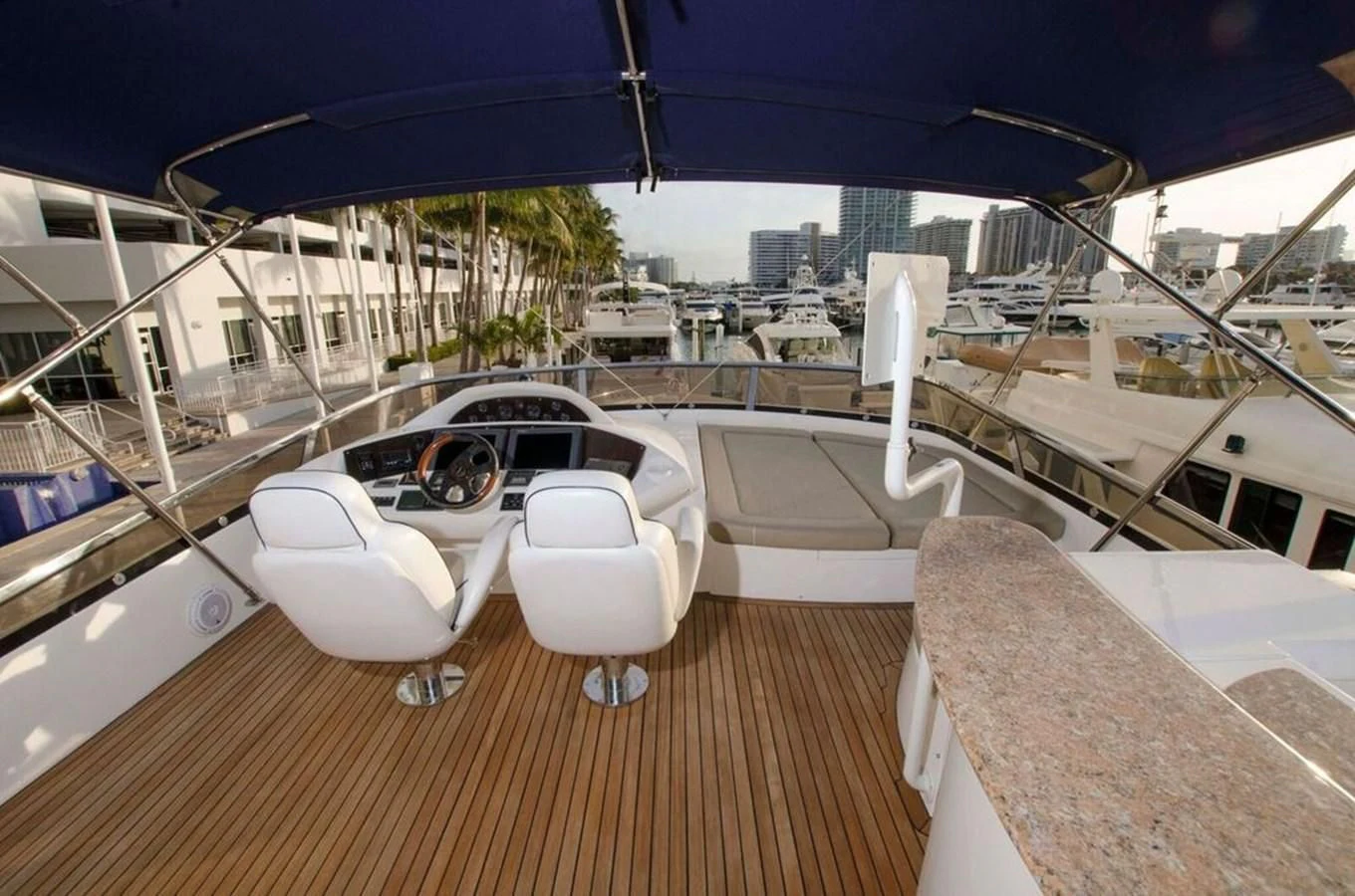 a deck with chairs and a table on it aboard SAMARA Yacht for Sale