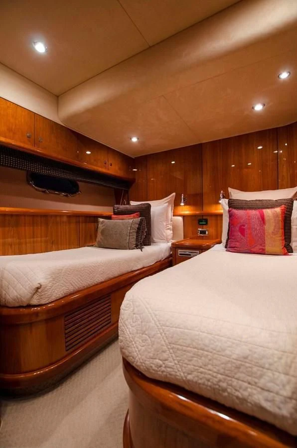 a room with two beds aboard SAMARA Yacht for Sale