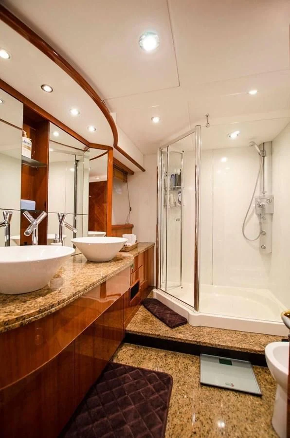 a bathroom with a sink and a mirror aboard SAMARA Yacht for Sale