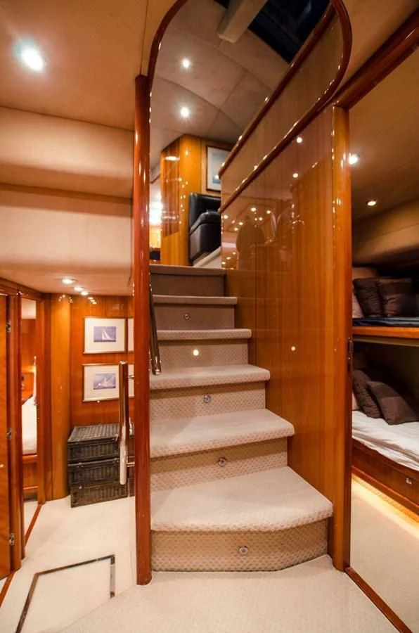 a wooden staircase in a room aboard SAMARA Yacht for Sale