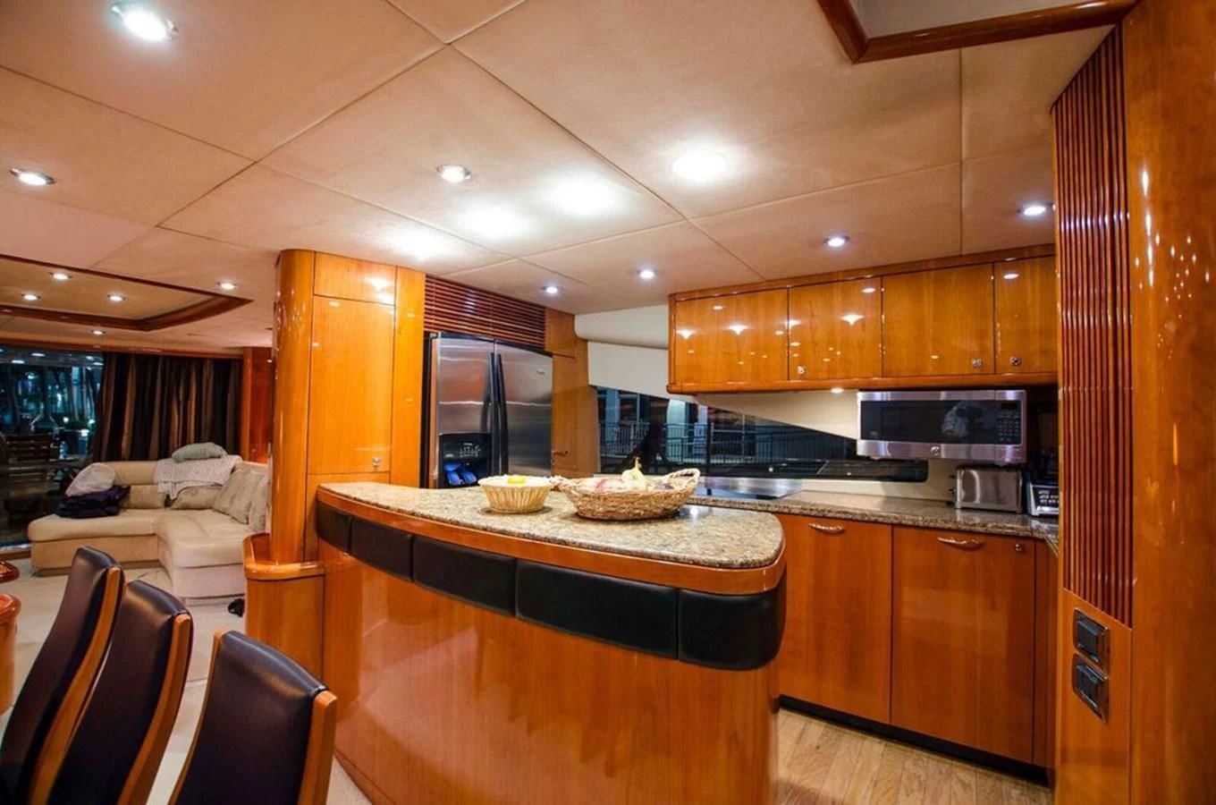 a kitchen with wooden cabinets aboard SAMARA Yacht for Sale