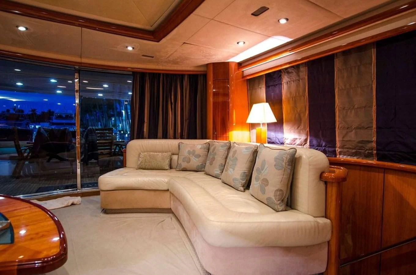 a living room with a couch and a table aboard SAMARA Yacht for Sale