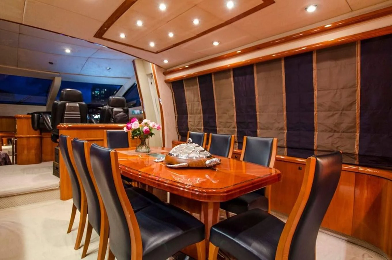 a dining room with a table and chairs aboard SAMARA Yacht for Sale