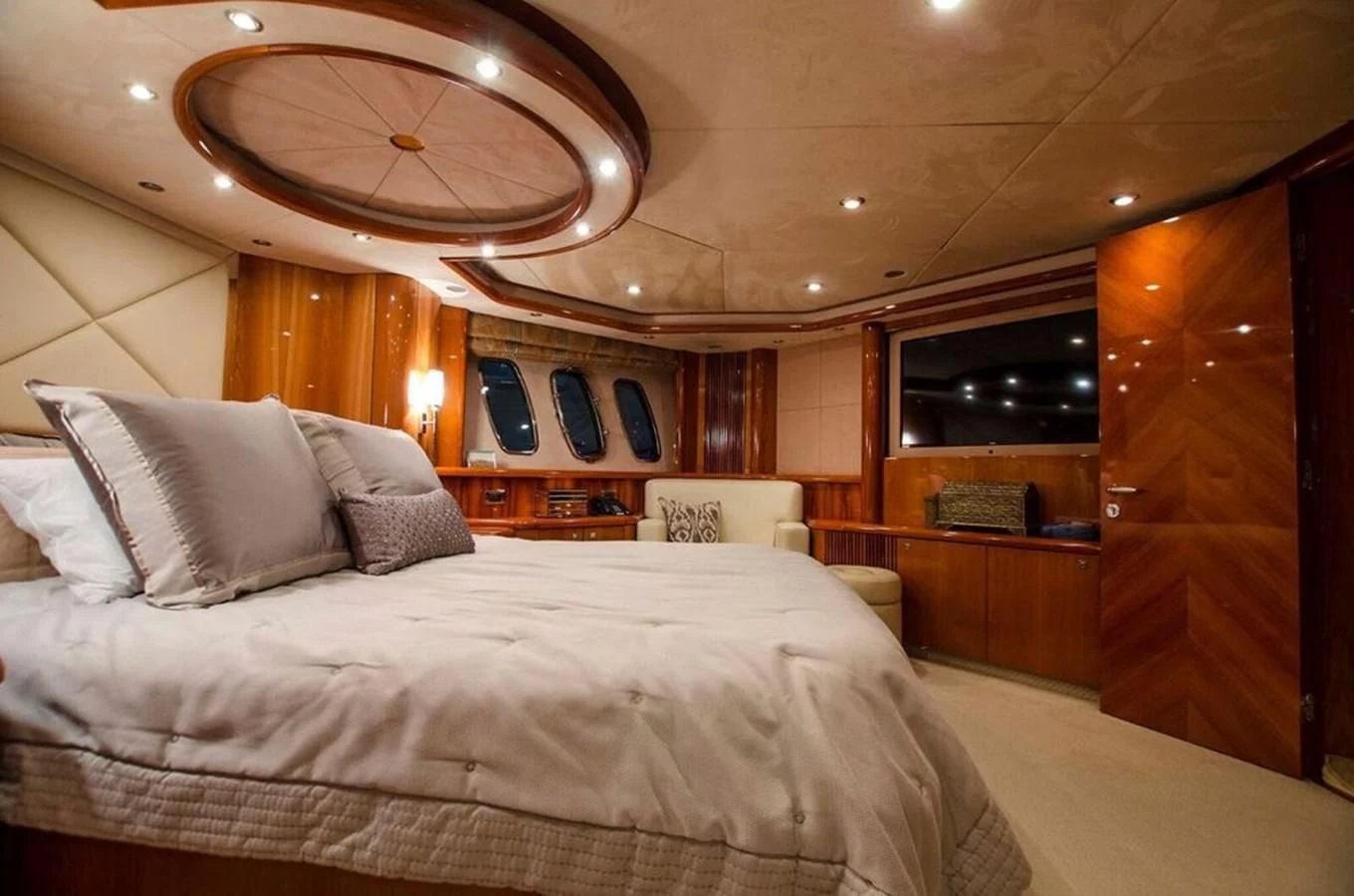 a bed with a white bed spread aboard SAMARA Yacht for Sale