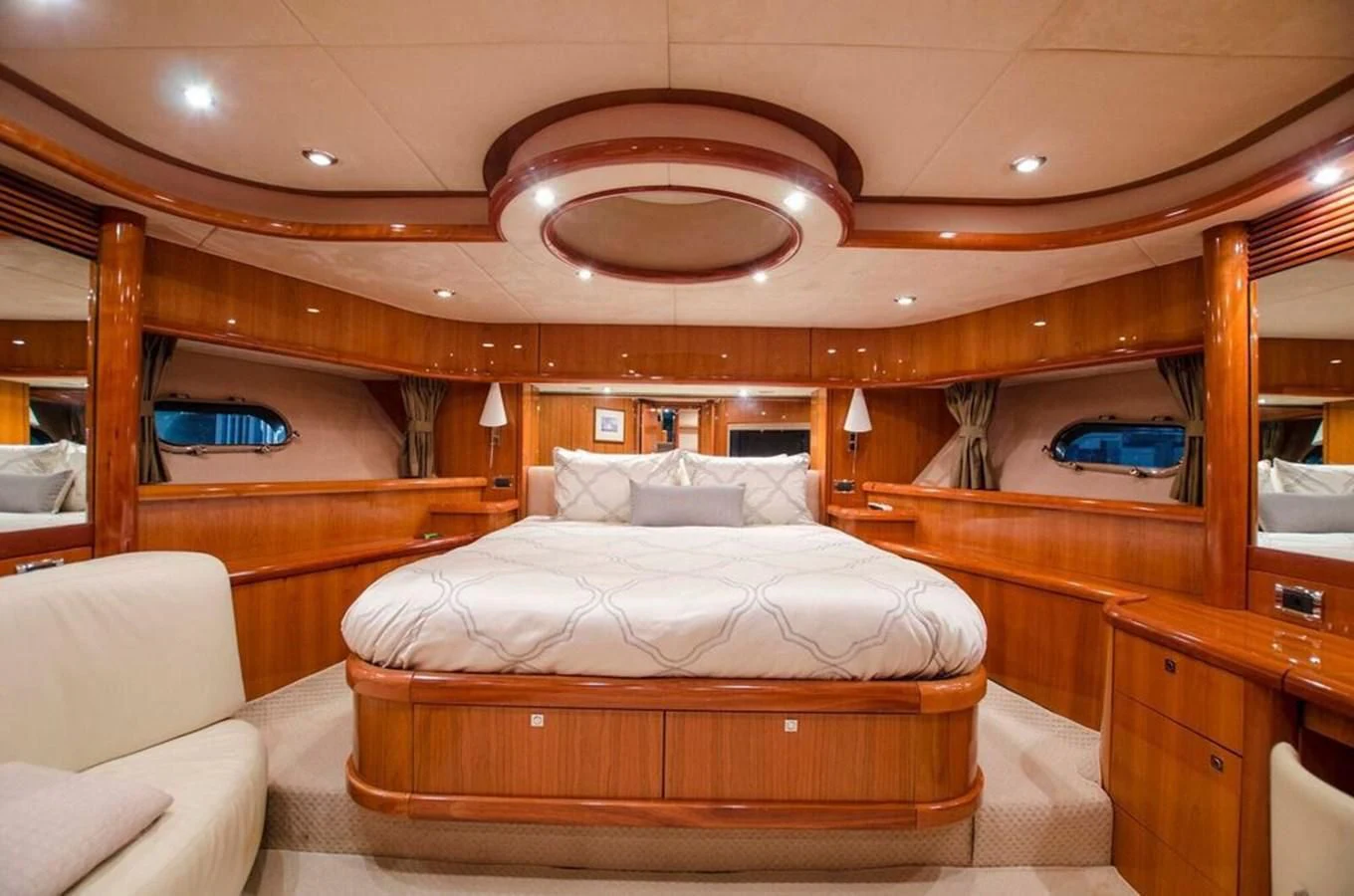 a room with a bed and a couch aboard SAMARA Yacht for Sale