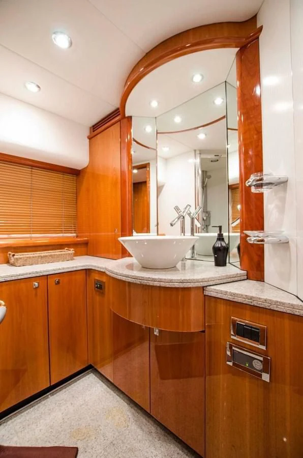 a bathroom with a large mirror aboard SAMARA Yacht for Sale