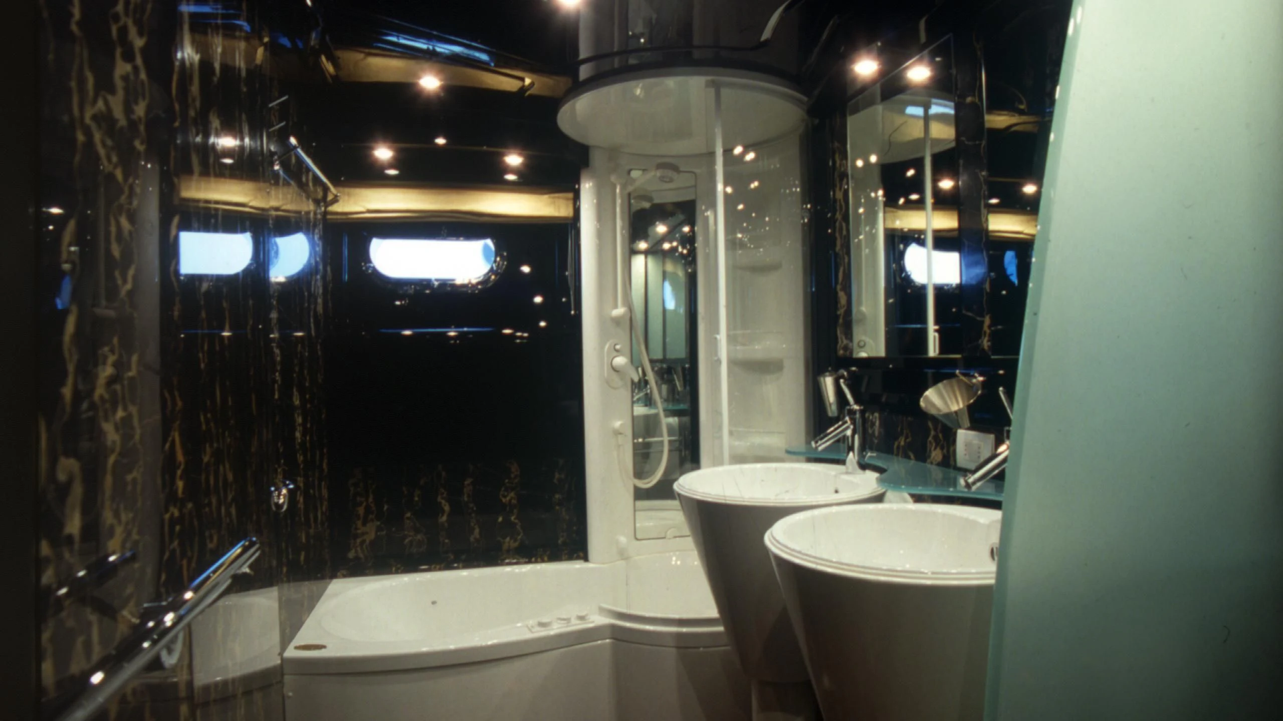 a bathroom with a bathtub and sink aboard IF Yacht for Sale