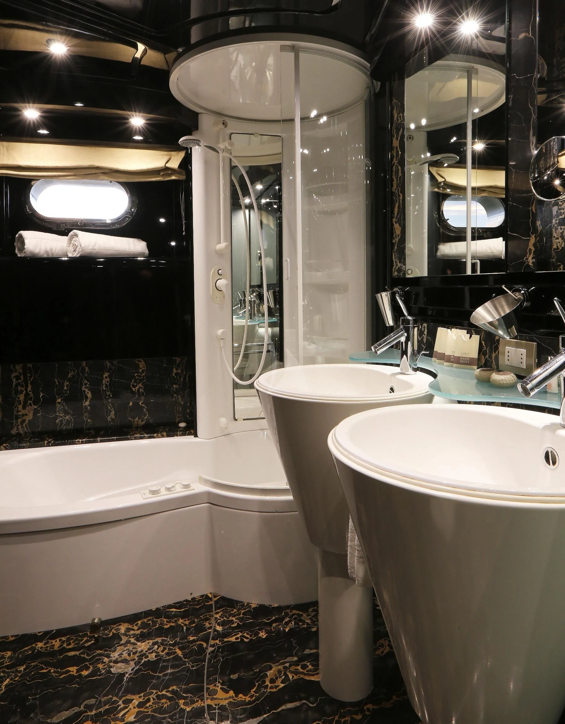 a bathroom with a bathtub sink and a toilet aboard IF Yacht for Sale
