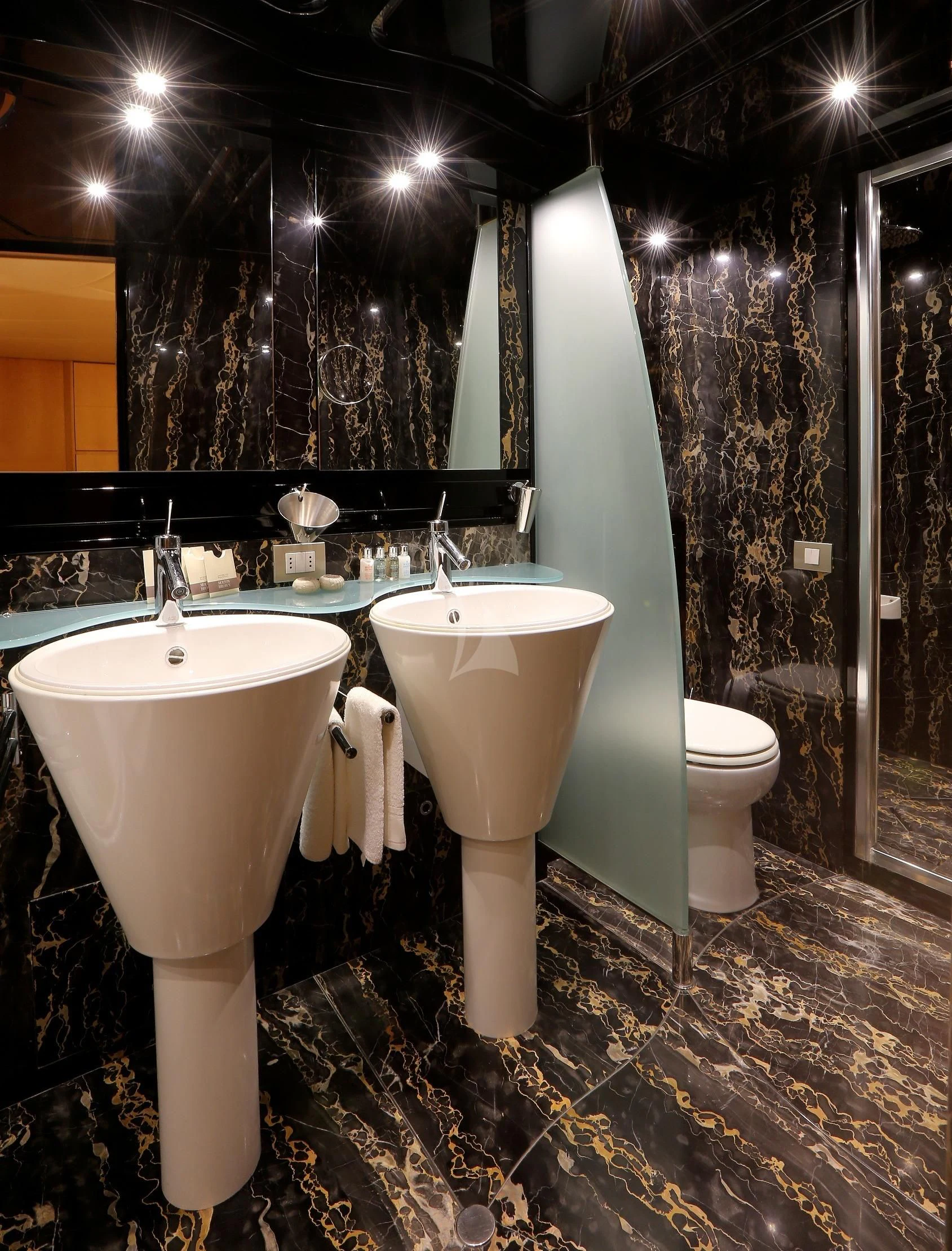 a bathroom with a sink and a urinal aboard IF Yacht for Sale