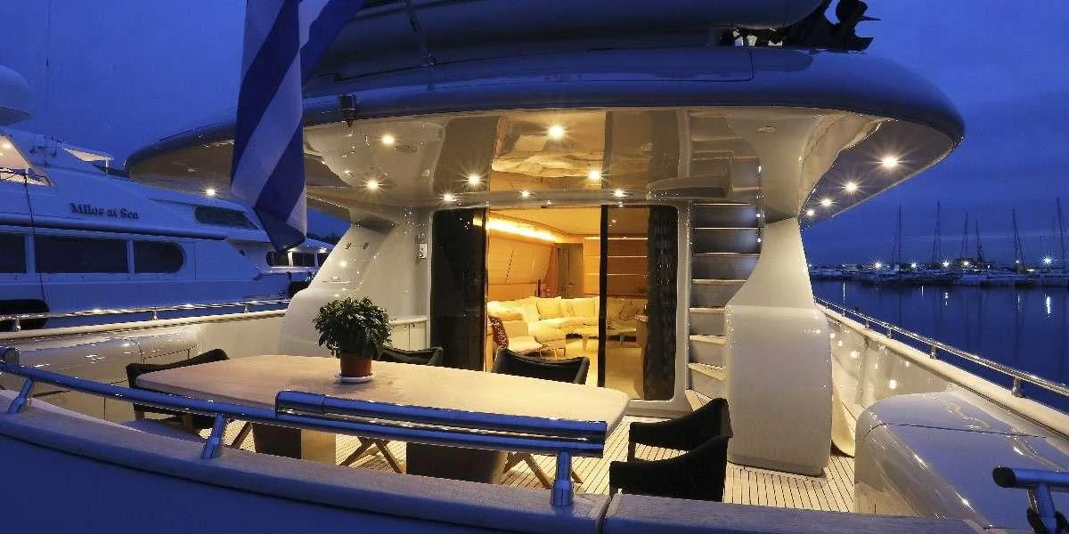 a room with a table and chairs aboard IF Yacht for Sale