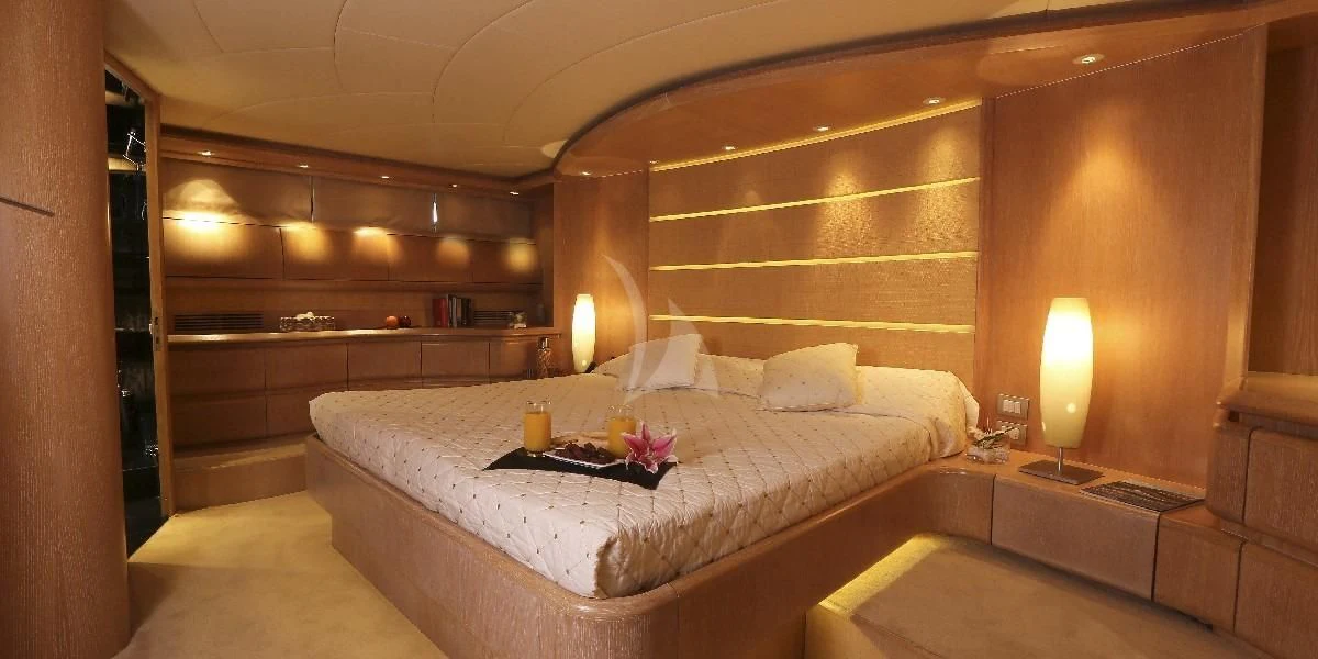 a large bed in a room aboard IF Yacht for Sale