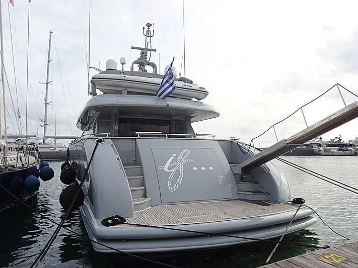 a boat with a flag on it aboard IF Yacht for Sale