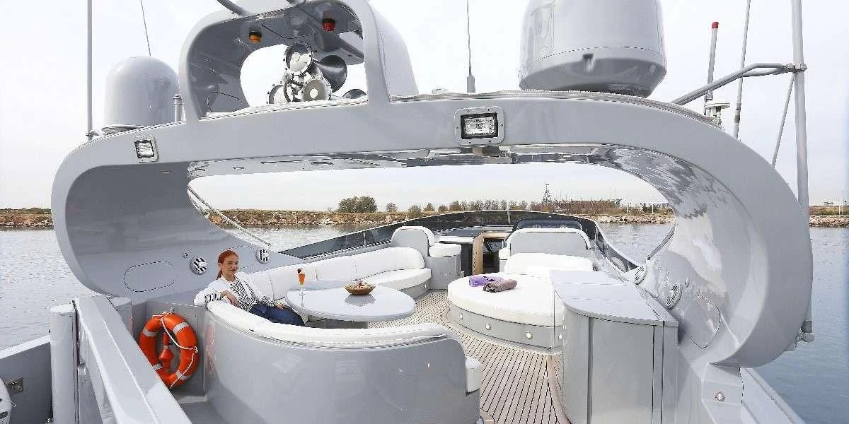 a person sitting in a white boat aboard IF Yacht for Sale