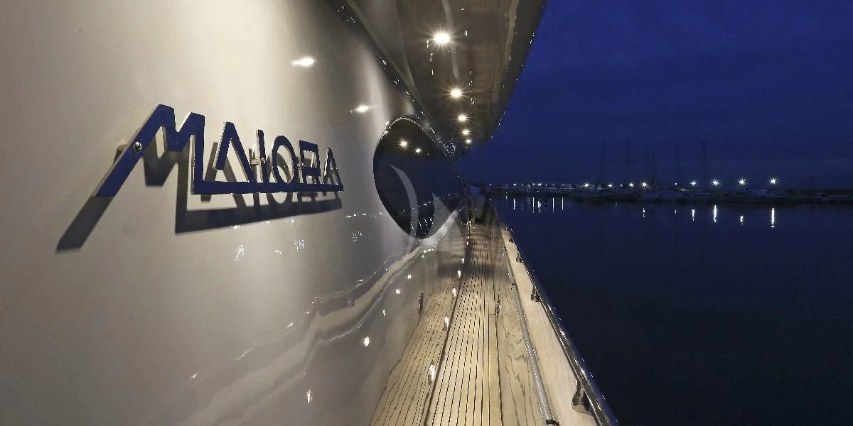 a white car with a sign on it aboard IF Yacht for Sale