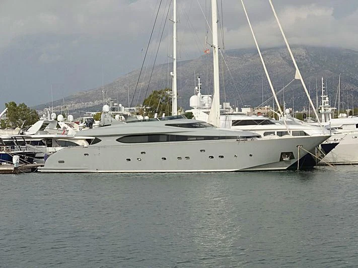 a white yacht in a harbor aboard IF Yacht for Sale