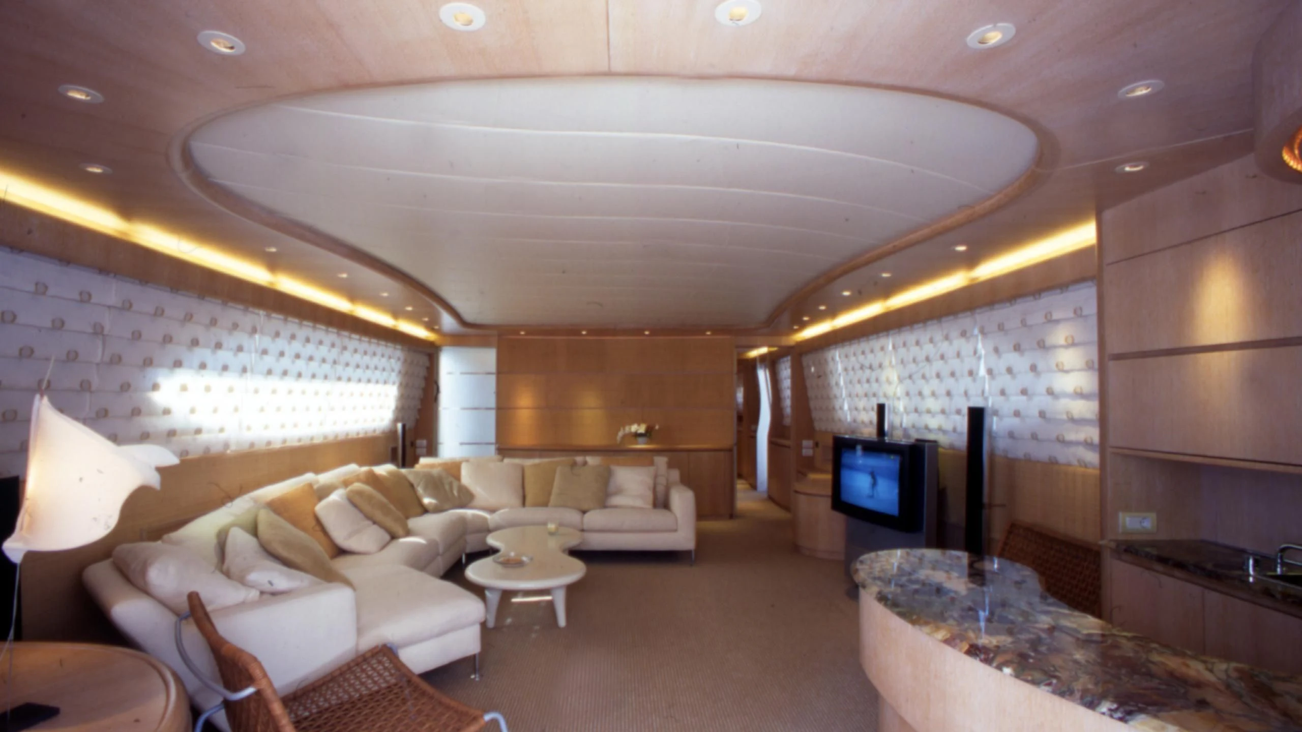 a room with a couch and a tv aboard IF Yacht for Sale